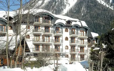 a large building with snow on top of it at MontBlanc11 in Chamonix-Mont-Blanc