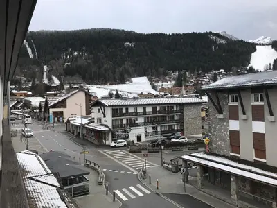 an aerial view of a town with a snow covered mountain at Appartement rénové 1 chambre avec balcon, parking et wifi centre station - FR-1-836-62 in Arâches-la-Frasse