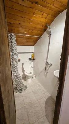 a bathroom with a toilet and a sink at Mini cozy au MontBlanc in Sallanches