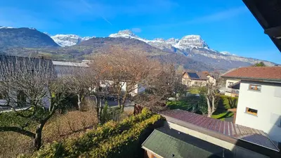 a view of snow capped mountains from a house at Mini cozy au MontBlanc in Sallanches