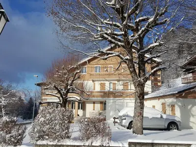 a house with a car parked in the snow at Appartement rénové 2 chambres, centre station, 300m des pistes, 6 pers, WiFi - FR-1-836-63 in Arâches-la-Frasse