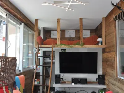a living room with a flat screen tv on a wall at Appartement rénové 2 chambres, centre station, 300m des pistes, 6 pers, WiFi - FR-1-836-63 in Arâches-la-Frasse