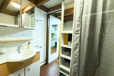 a bathroom with a sink and a shower curtain at Bright studio with a view of Mont Blanc in Chamonix-Mont-Blanc