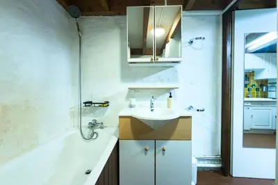 a bathroom with a sink and a bath tub at Bright studio with a view of Mont Blanc in Chamonix-Mont-Blanc