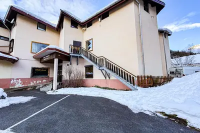 a large building with snow on the ground at Bright studio with a view of Mont Blanc in Chamonix-Mont-Blanc