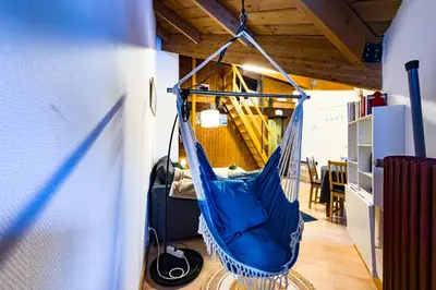 a blue hammock hanging from the ceiling of a room at Bright studio with a view of Mont Blanc in Chamonix-Mont-Blanc