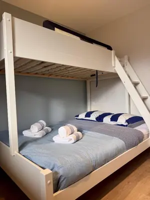 a bedroom with two bunk beds with towels on them at Le Saphir Montagne & Ski in Saint-Gervais-les-Bains