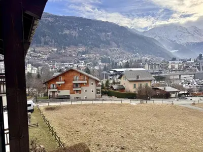 a view of a town with mountains in the background at Le Saphir Montagne & Ski in Saint-Gervais-les-Bains