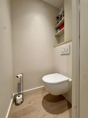 a bathroom with a white toilet in a room at Le Saphir Montagne & Ski in Saint-Gervais-les-Bains