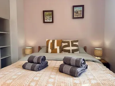 a bedroom with a bed with two pillows on it at Le Saphir Montagne & Ski in Saint-Gervais-les-Bains