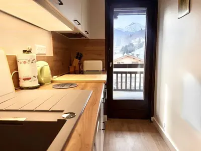 a kitchen with a view of a mountain at Le Saphir Montagne & Ski in Saint-Gervais-les-Bains