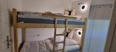 a bunk bed with two bunk beds in a room at Les Arcades N105 ST4 in Morillon