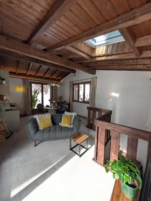 a living room with a couch and a table at Stunning New Apartment in Chamonix with Mont Blanc Views in Chamonix-Mont-Blanc