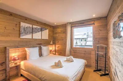 a bedroom with a bed with two towels on it at Appartement Thoret - 3 étoiles - Welkeys in Megève