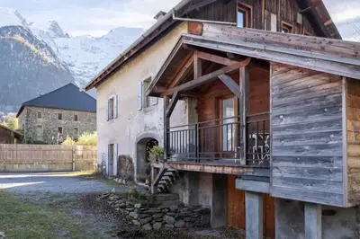 a house with a balcony on the side of it at Le Refuge in Chamonix-Mont-Blanc