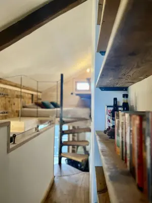 a kitchen with a counter with books on it at Le Refuge in Chamonix-Mont-Blanc