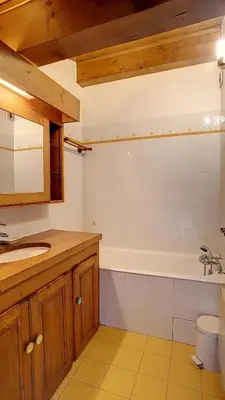 a bathroom with a sink and a bath tub at 1 Sporting Acacia 2 - JAILLET - in Megève