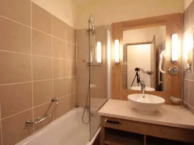 a bathroom with a tub and a sink and a shower at Appartement 2 Pièces Pied des Pistes avec Wi-Fi et Parking - FR-1-687-120 in Arâches-la-Frasse