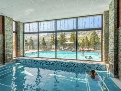 a large swimming pool with a large window at Appartement 2 Pièces Pied des Pistes avec Wi-Fi et Parking - FR-1-687-120 in Arâches-la-Frasse