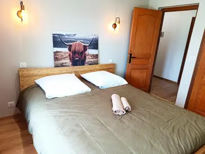 a bedroom with a bed with two towels on it at Le Cairn in Saint-Gervais-les-Bains