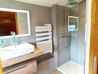a bathroom with a sink and a shower at Le Cairn in Saint-Gervais-les-Bains