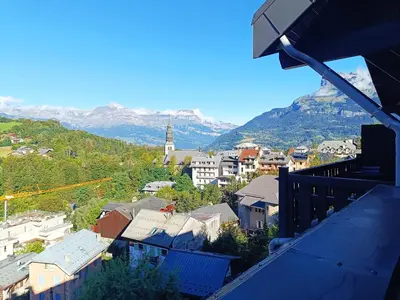 a view of a town with mountains in the background at La Comtesse in Saint-Gervais-les-Bains
