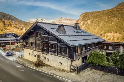 an old house on the side of a road at Rosaline Ferme 220m2 Charme Cheminee Jacuzzi Sauna in Les Houches
