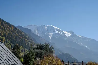a view of a snow covered mountain in the distance at Canopée Duplex 4 CH Proche Remontees Central Vues in Saint-Gervais-les-Bains