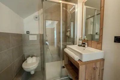 a bathroom with a sink and a toilet and a shower at Canopée Duplex 4 CH Proche Remontees Central Vues in Saint-Gervais-les-Bains
