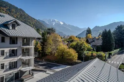 an aerial view of a house with mountains in the background at Canopée Duplex 4 CH Proche Remontees Central Vues in Saint-Gervais-les-Bains