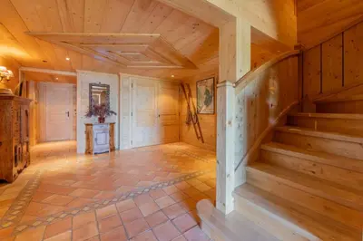 a hallway with a staircase in a wooden house at Véroce Chalet Calme 10PAX Cheminee Vue in Saint-Gervais-les-Bains