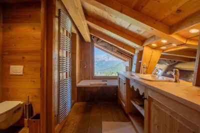 a bathroom with a sink and a window at Véroce Chalet Calme 10PAX Cheminee Vue in Saint-Gervais-les-Bains