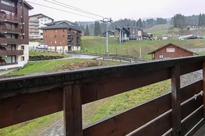 a view from a balcony of a city with houses at Le Repos du Skieur - Au pied des pistes in Morillon