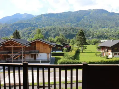 a view from the balcony of a house at Charmant duplex 7 pers à Samoëns avec piscine et Wi-Fi - FR-1-815-46 in Samoëns