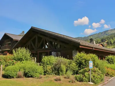 a wooden building with a sign in front of it at Charmant duplex 7 pers à Samoëns avec piscine et Wi-Fi - FR-1-815-46 in Samoëns