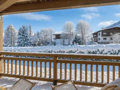 a winter view from the balcony of a house at Duplex au pied de la télécabine à Megève - 4 chambres - FR-1-569-204 in Megève