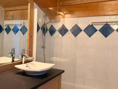 a bathroom with a sink and a shower at Appartement cosy 3 pièces près des pistes avec parking - FR-1-572-344 in Arâches-la-Frasse