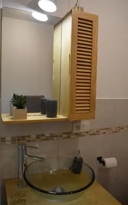 a bathroom with a sink and a mirror at Appartement aux portes de St Gervais in Saint-Gervais-les-Bains