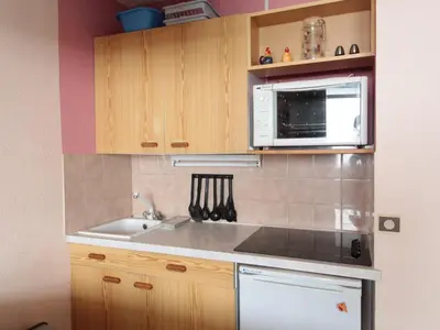 a large building with a black at Studio en montagne pour 4 pers, balcon sud, animaux admis - FR-1-687-121 in Arâches-la-Frasse