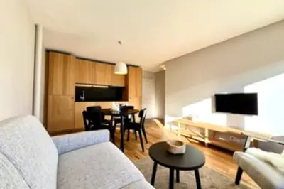 a living room with a couch and a table at Bright apartment with terrace in Megève in Megève