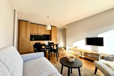 a living room with a couch and a table at Bright apartment with terrace in Megève in Megève