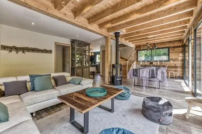 a living room with a couch and a table at Chalet 18 guests, 8 bedrooms, 5 bathrooms & Sauna! in Les Houches