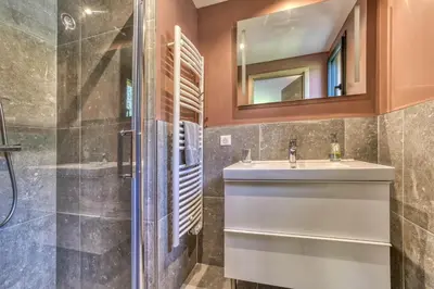 a bathroom with a sink and a shower at Chalet 18 guests, 8 bedrooms, 5 bathrooms & Sauna! in Les Houches