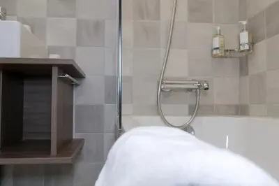 a shower with a glass door in a bathroom at Chalet 7CH Groupes Centre-ville Sauna in Chamonix-Mont-Blanc