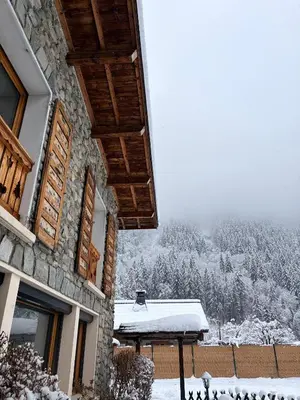 a wooden railing with a view of a mountain at Chalet d'Honneur in Chamonix-Mont-Blanc