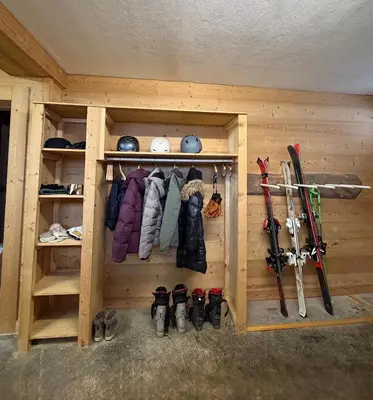 a living room with a couch and a television at Chalet d'Honneur in Chamonix-Mont-Blanc