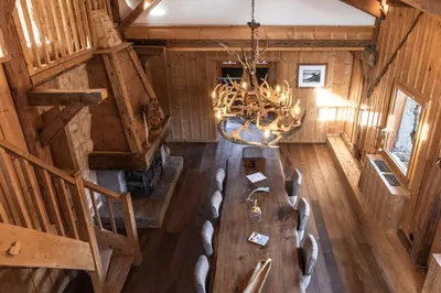 an overhead view of a dining room with a table and chairs at Chalet Paris Mont-Blanc Luxe et authenticite in Saint-Gervais-les-Bains