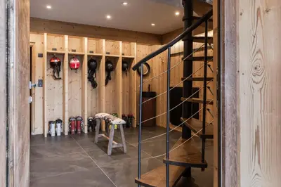 a room with a staircase in a baseball dugout at Chalet Paris Mont-Blanc Luxe et authenticite in Saint-Gervais-les-Bains