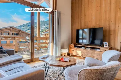 a balcony with chairs and a view of a mountain at Discreet Alpine Luxury Suite Art of Living in Megève in Megève