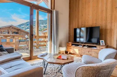 a kitchen and dining room with a table and chairs at Discreet Alpine Luxury Suite Art of Living in Megève in Megève